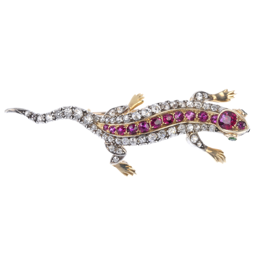 An early 20th century silver and gold, ruby, diamond and demantoid garnet lizard brooch. The