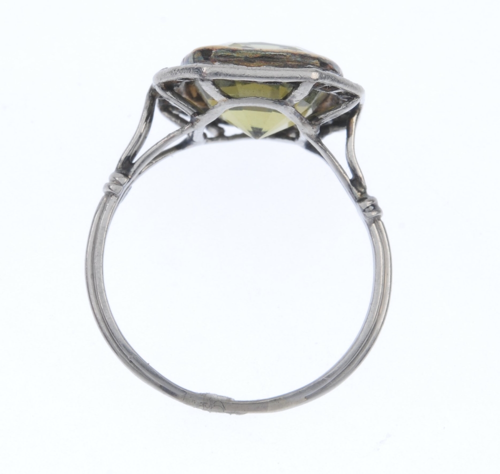 A mid 20th century chrysoberyl and diamond cluster ring. The cushion-shape yellowish green - Image 4 of 4