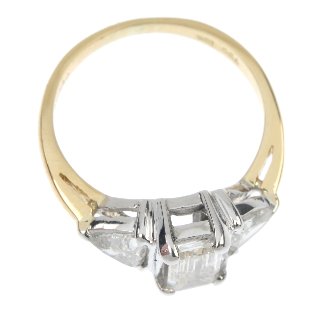 An 18ct gold diamond three-stone ring. The rectangular-shape diamond, to the triangular-shape - Image 2 of 4