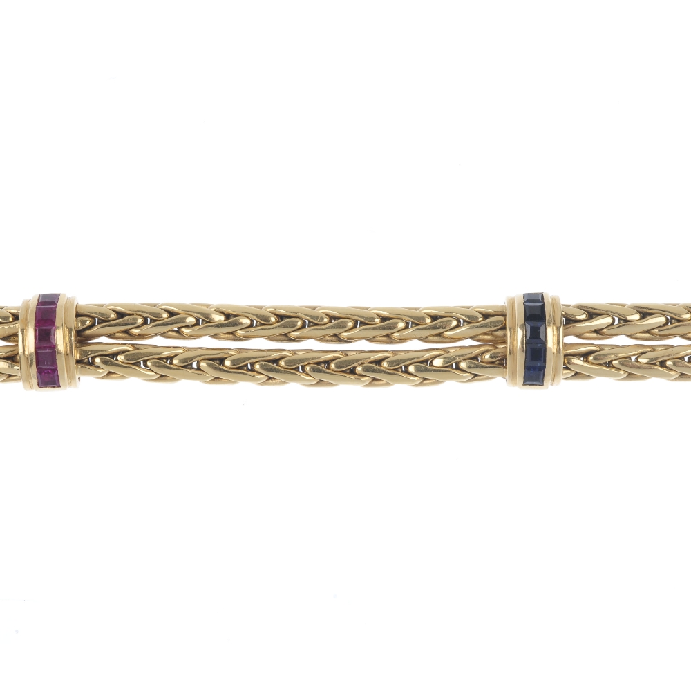 An 18ct gold diamond and gem-set bracelet. The looped rope-twist chain, with calibre-cut sapphire, - Image 4 of 5