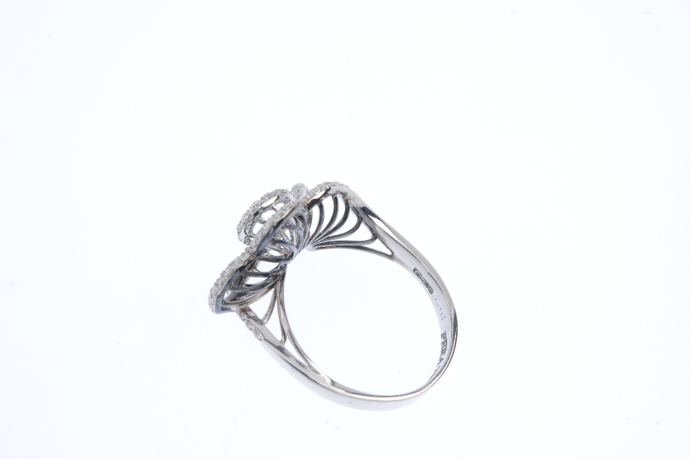 An 18ct gold diamond floral ring. Of wirework design, the graduated brilliant-cut diamond - Image 3 of 4