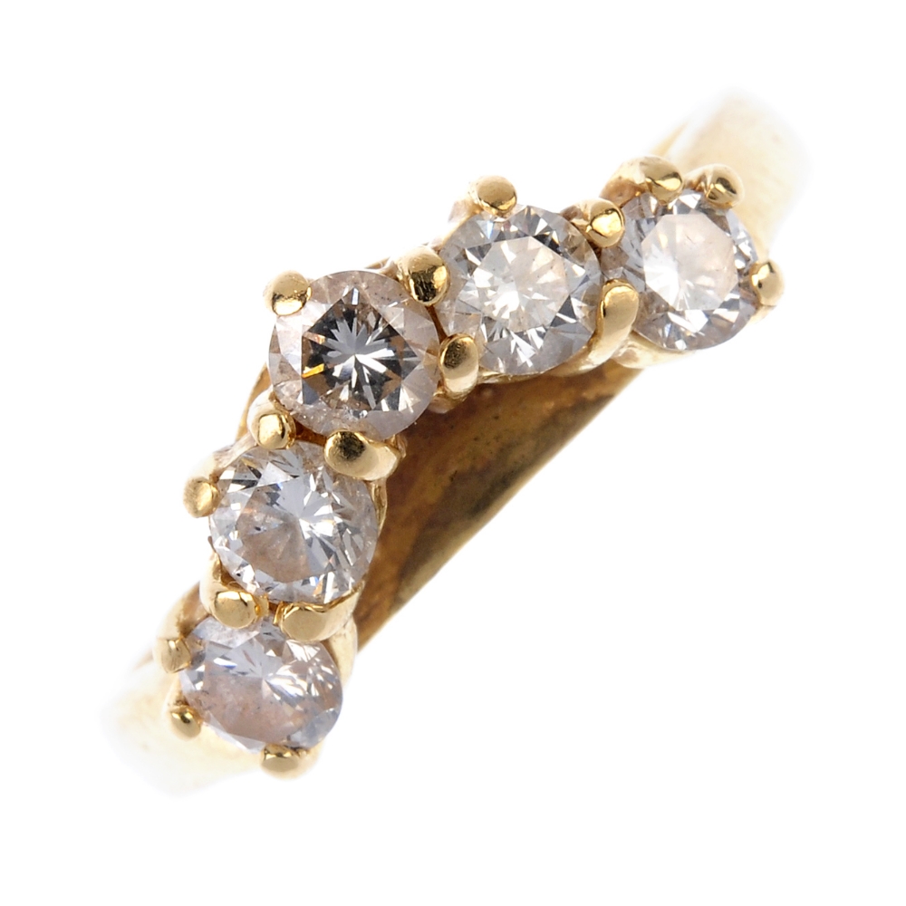 A diamond dress ring. The brilliant-cut diamond chevron, to the plain band. Estimated total