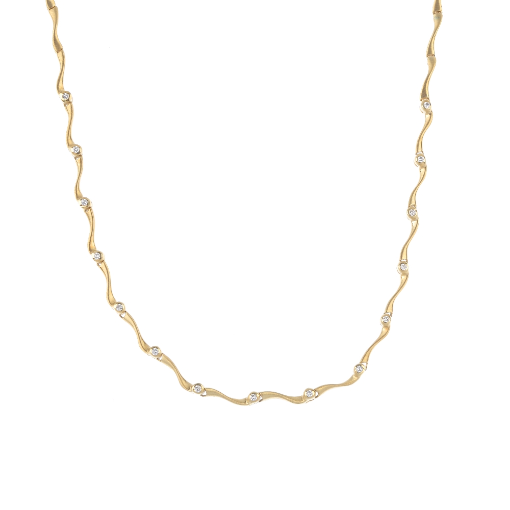 An 18ct gold diamond necklace. The front designed as a series of brilliant-cut diamond collet and