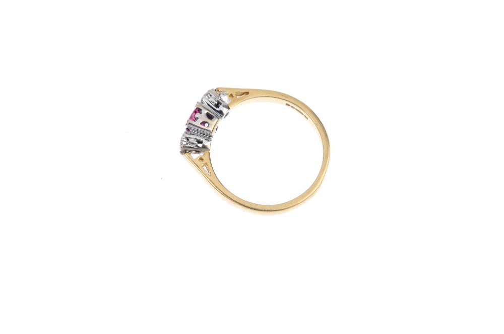 An 18ct gold ruby and diamond three-stone ring. The oval-shape ruby, with brilliant-cut diamond - Image 3 of 4