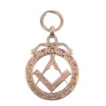 An early 20th century 9ct gold Masonic fob. Of openwork design, the engraved compass and set-square,