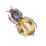 An early 20th century gold gem-set spider brooch. The oval-shape citrine and amethyst collet body,