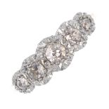 A mid 20th century 18ct gold and platinum diamond five-stone ring. The graduated old-cut diamonds,