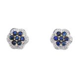 A pair of sapphire and diamond floral cluster ear studs. Each designed as a circular-shape