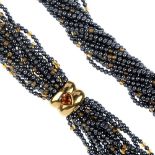 A citrine and heamatite necklace. The multi-strand heamatite bead necklace, with citrine bead