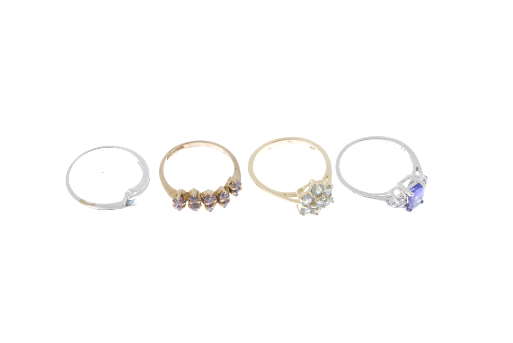 A selection of four 9ct gold gem-set dress rings. To include a coloured treated blue diamond - Image 3 of 4