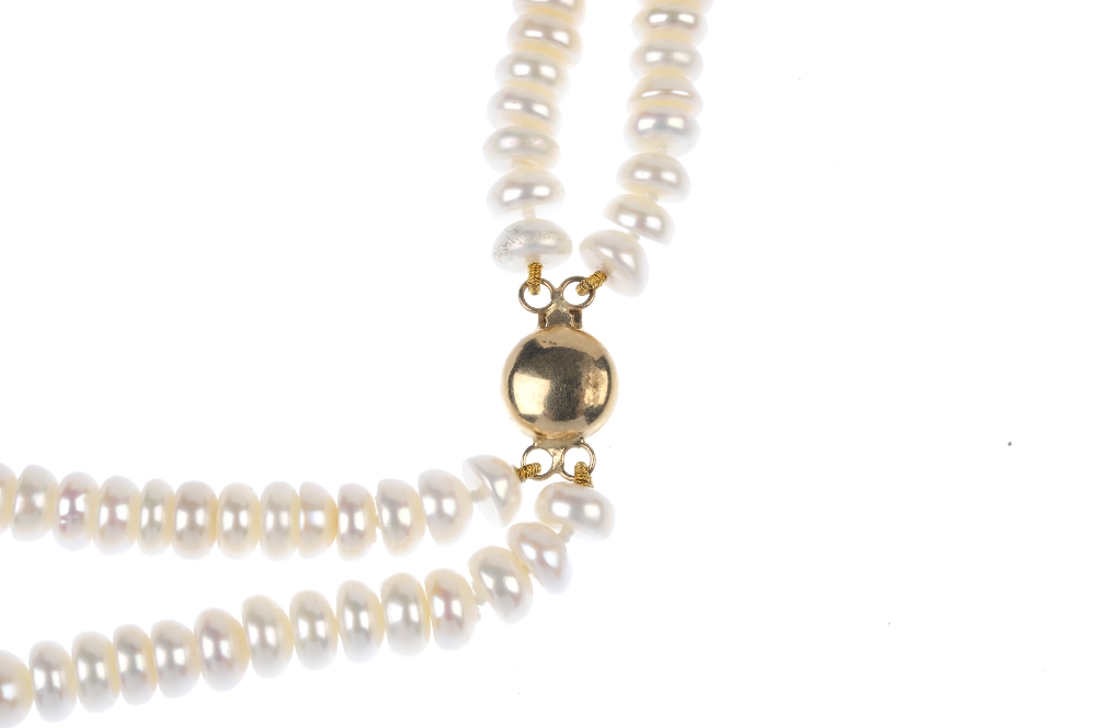 A freshwater cultured pearl two-row necklace. Comprising two strands of button-shape freshwater - Image 2 of 3