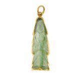 A carved gem figural pendant. Carved as a robed figure, within a collet surround. Asian character