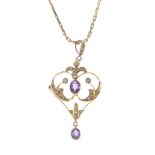 An early 20th century 9ct gold amethyst and split pearl pendant. The oval-shape amethyst, within a