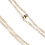 A freshwater cultured pearl two-row necklace. Comprising two strands of button-shape freshwater