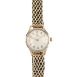 OMEGA - a lady's 9ct gold manual wind wristwatch. The circular-shape white dial, with gold