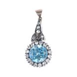 A set of mid 20th century zircon jewellery. The pendant designed as a circular-shape blue zircon and