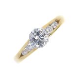 An 18ct gold diamond single-stone ring. The brilliant-cut diamond, to the similarly-cut diamond