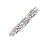 A mid 20th century 18ct gold diamond half-circle eternity ring. The rose-cut diamond line, with