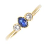 An 18ct gold sapphire and diamond three-stone ring. The oval-shape sapphire collet, to the