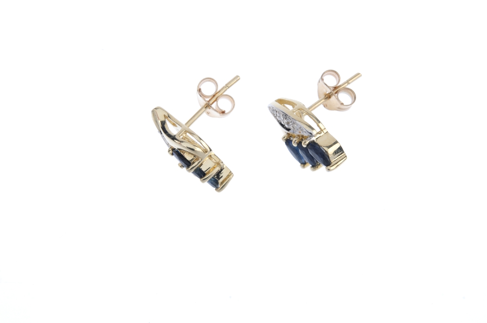 A pair of sapphire and diamond ear studs. Each designed as three marquise-shape sapphires, with - Image 2 of 2