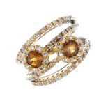 A citrine and paste dress ring. The circular-shape citrine and colourless paste clusters, to the