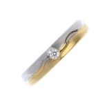 An 18ct gold diamond single-stone band ring. Of bi-colour design, the brilliant-cut diamond inset to