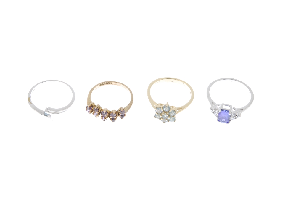 A selection of four 9ct gold gem-set dress rings. To include a coloured treated blue diamond - Image 2 of 4