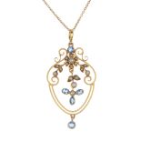 An early 20th century 9ct gold aquamarine and split pearl pendant. The split pearl and circular-