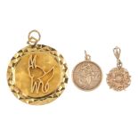 A selection of three 9ct gold pendants. To include a St Christopher pendant, a Tudor Rose pendant