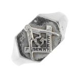 A Masonic signet ring. The hexagonal panel, depicting the square and compass symbol, to the