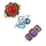 A selection of three 9ct gold gem-set rings. To include a mid 20th century coral floral dress