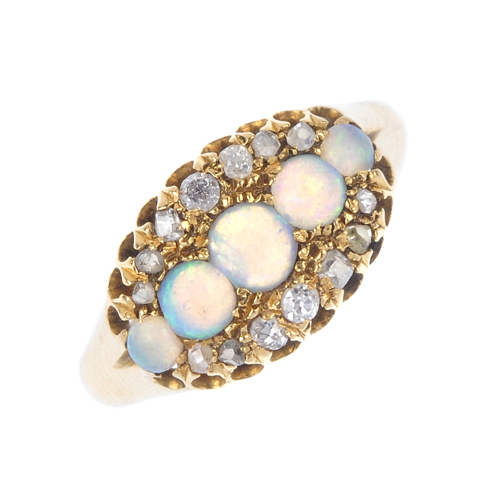 A late 19th century gold opal and diamond dress ring. The graduated circular-shape opal cabochon