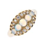 A late 19th century gold opal and diamond dress ring. The graduated circular-shape opal cabochon
