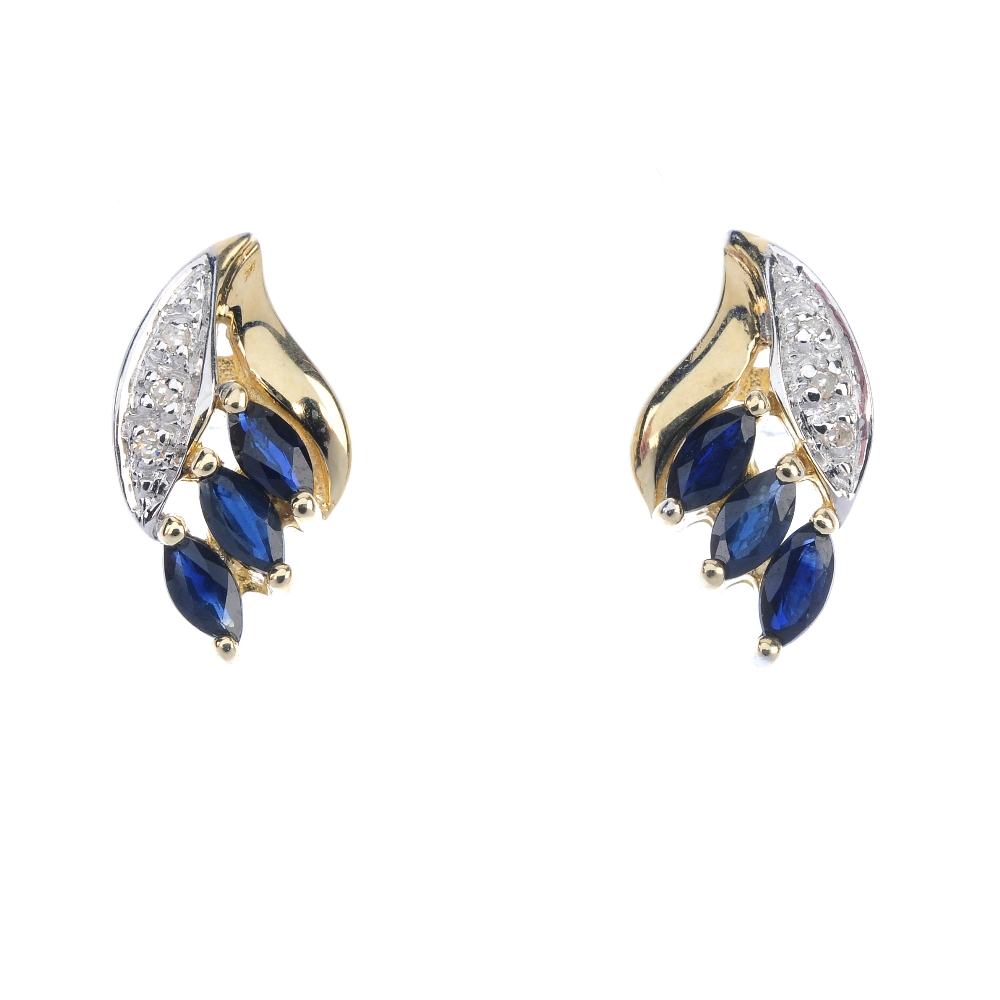 A pair of sapphire and diamond ear studs. Each designed as three marquise-shape sapphires, with