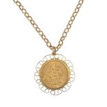 A half-sovereign pendant. The half-sovereign, dated 1914, within a scrolling openwork surround,