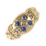 An early 20th century 18ct gold sapphire and diamond ring. The circular-shape sapphire and diamond