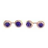 A pair of mid 20th century foil back amethyst cufflinks. Each designed as a circular foil back