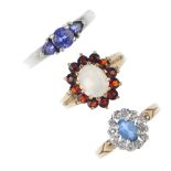 A selection of three 9ct gold gem-set rings. To include a vari-shape tanzanite three-stone ring,