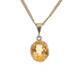 A citrine single-stone pendant. The oval-shape citrine, to the openwork gallery, suspended from a