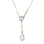 An early 20th century gold aquamarine and seed pearl necklace. The pear-shape aquamarine drop,