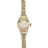 A lady's 1940s 9ct gold manual wind wristwatch. The circular-shape white dial and Arabic numerals,
