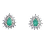 A pair of 9ct gold emerald and diamond cluster ear studs. The pear-shape emerald, within a single-