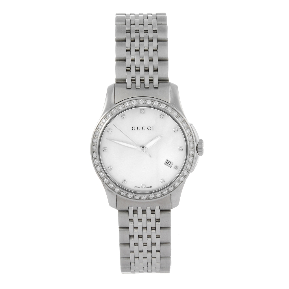 GUCCI - a lady's 126.5 bracelet watch. Stainless steel case with factory diamond set bezel. Numbered