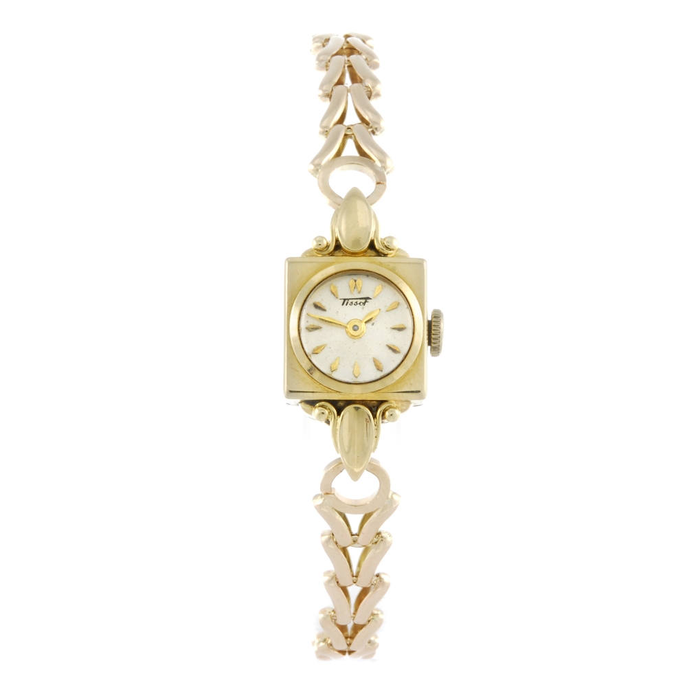 TISSOT - a lady's bracelet watch. Yellow metal case, stamped 18K 0750 with poincon. Numbered