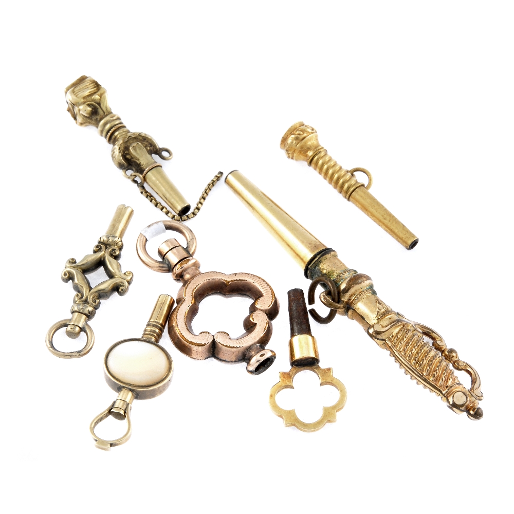 A small group of seven yellow metal pocket watch keys. One in the shape of a sword. 12gms.  Keys