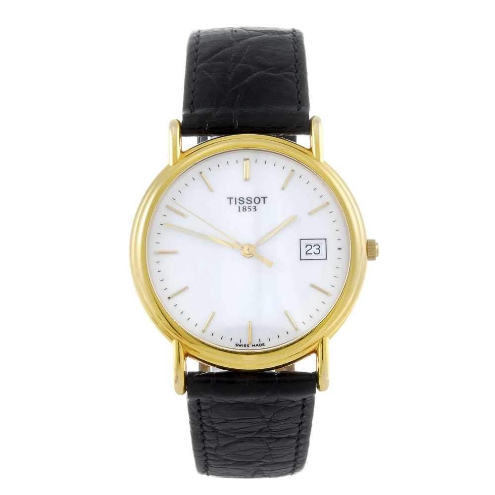 TISSOT - a gentleman's wrist watch. 18ct yellow gold case. Numbered G 667.330. Unsigned quartz