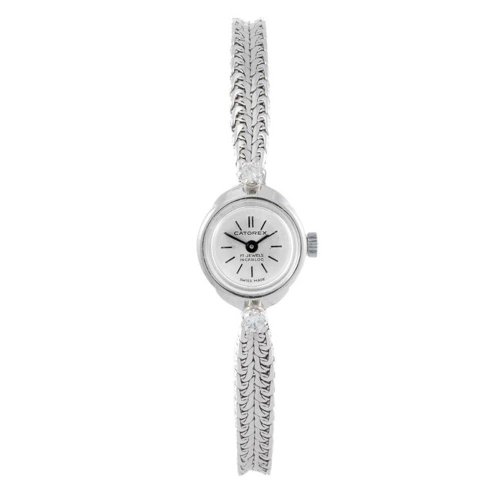 CATOREX - a lady's bracelet watch. White metal case, stamped 18k, 0.750. Unsigned manual wind