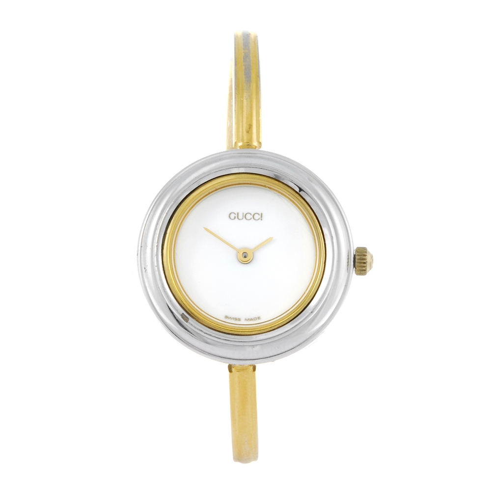 GUCCI - a lady's 11/12.2 bracelet watch. Bi-colour case. Numbered 1185629. Signed quartz movement.