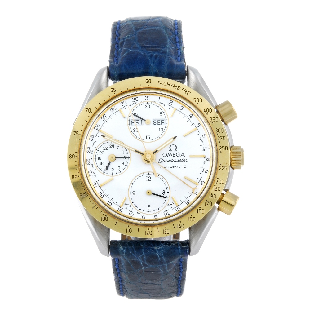 OMEGA - a gentleman's Speedmaster chronograph wrist watch. Stainless steel case with yellow metal