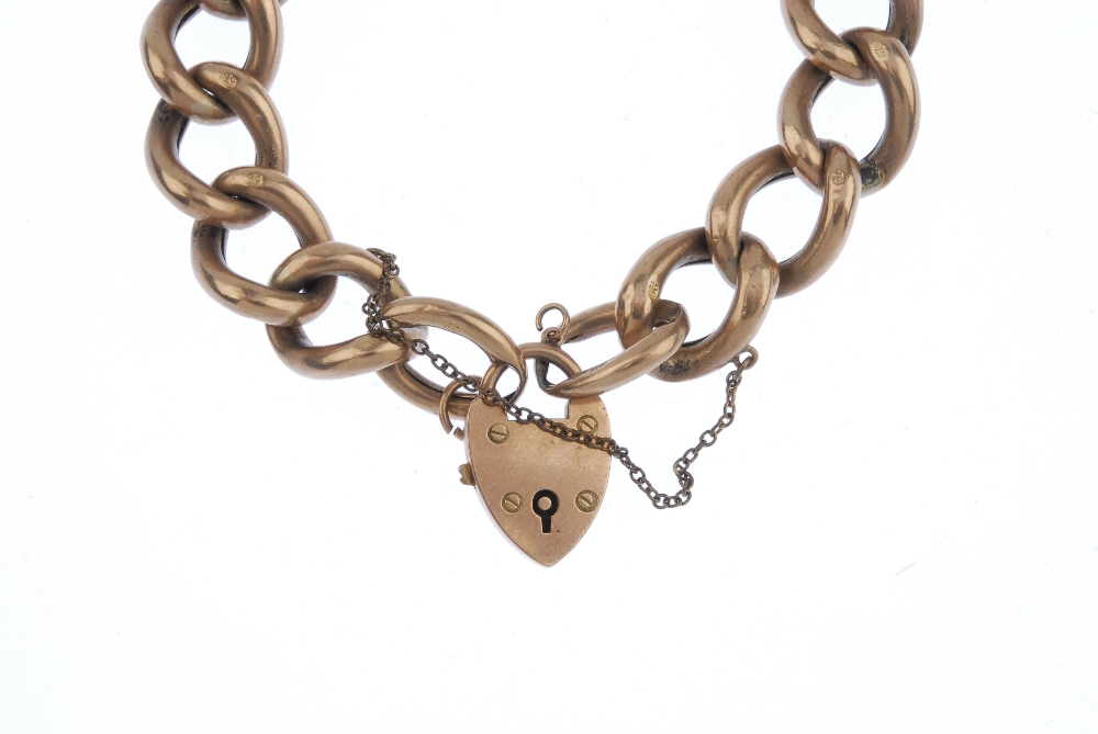 A late 19th century 9ct gold curb-link bracelet. Designed as a series of curb links, to the - Image 2 of 3